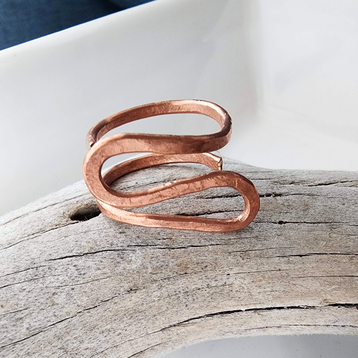 Handmade copper wave ring, adjustable copper ring, ocean-inspired jewelry, Blessed Knots design, artisan-crafted ring, boho-chic jewelry, sustainable fashion ring, unique handmade ring, wavy texture ring, exclusive copper jewelry