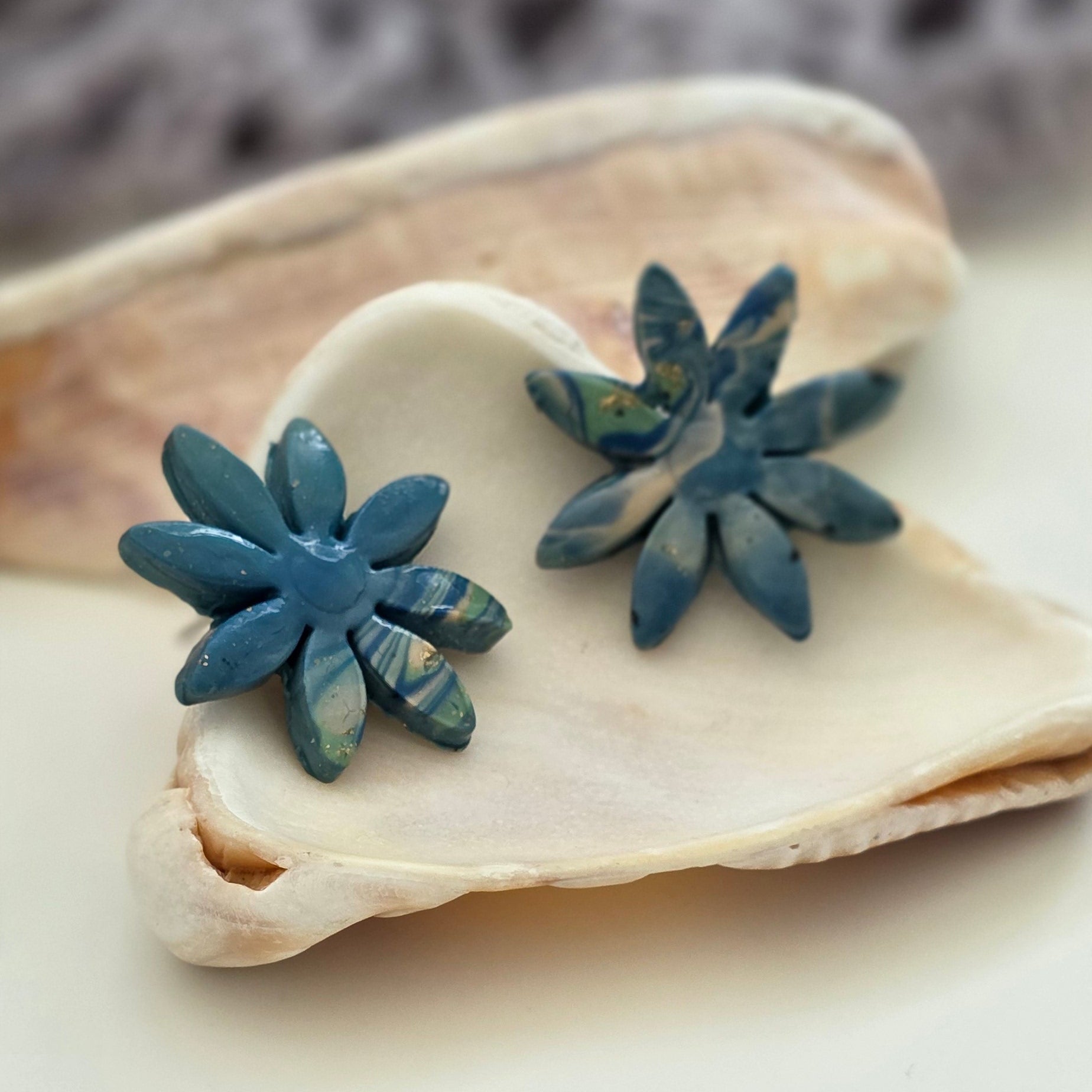 aretes hechos a mano
aretes artesanales
aretes florales
aretes marmoleados
stud earrings handmade
marbled earrings
handmade flower earrings
blue earrings
aretes azules
ocean-inspired jewelry
coastal jewelry
beach-inspired earrings
boho earrings
organic jewelry
unique handmade earrings
lightweight earrings
artisan jewelry
handmade jewelry Puerto Rico
Blessed Knots
limited edition jewelry