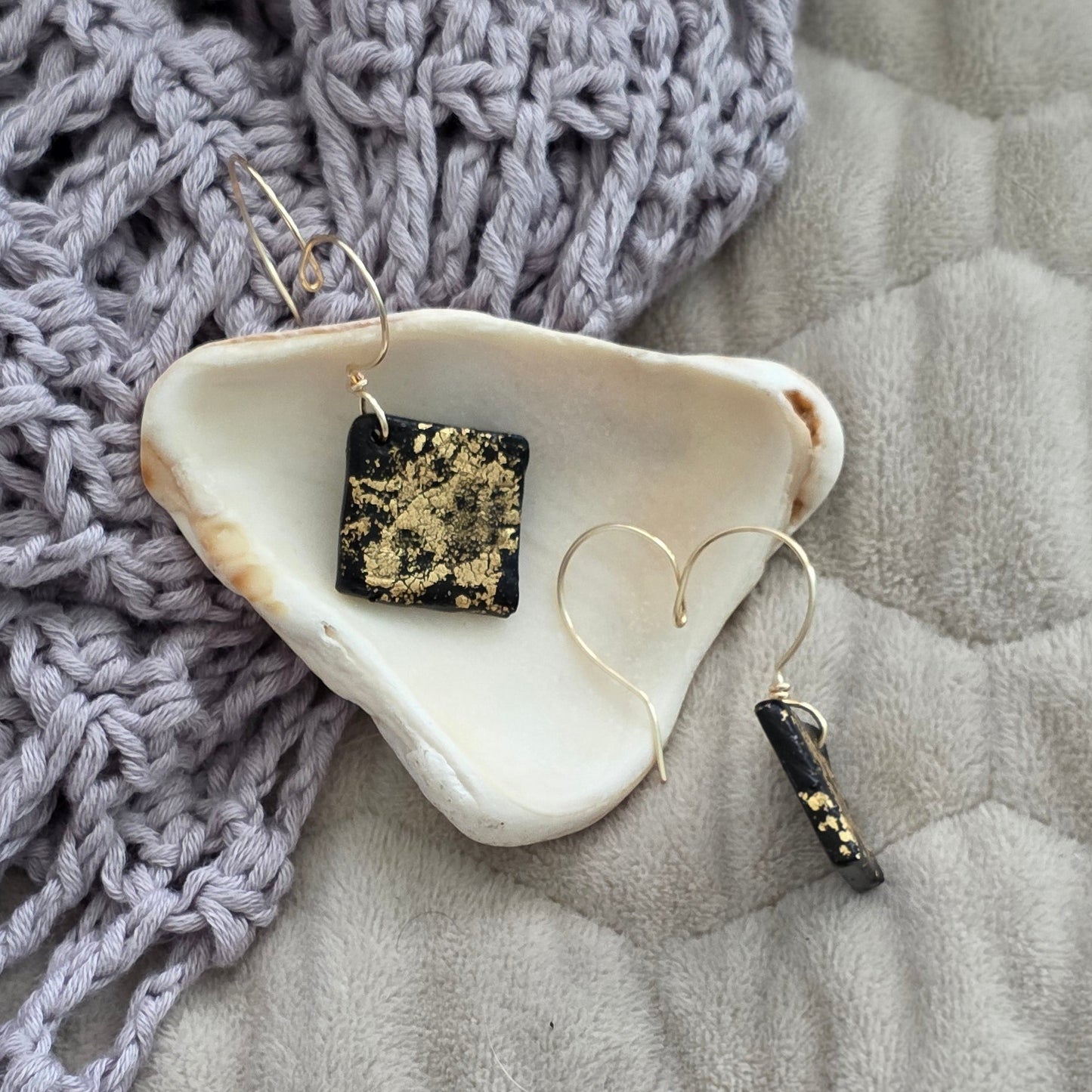 polymer clay earrings, black earrings, gold earrings, geometric earrings, handmade earrings, artisan jewelry, statement earrings, modern earrings, minimalist jewelry, dangle earrings, elegant earrings, unique earrings
