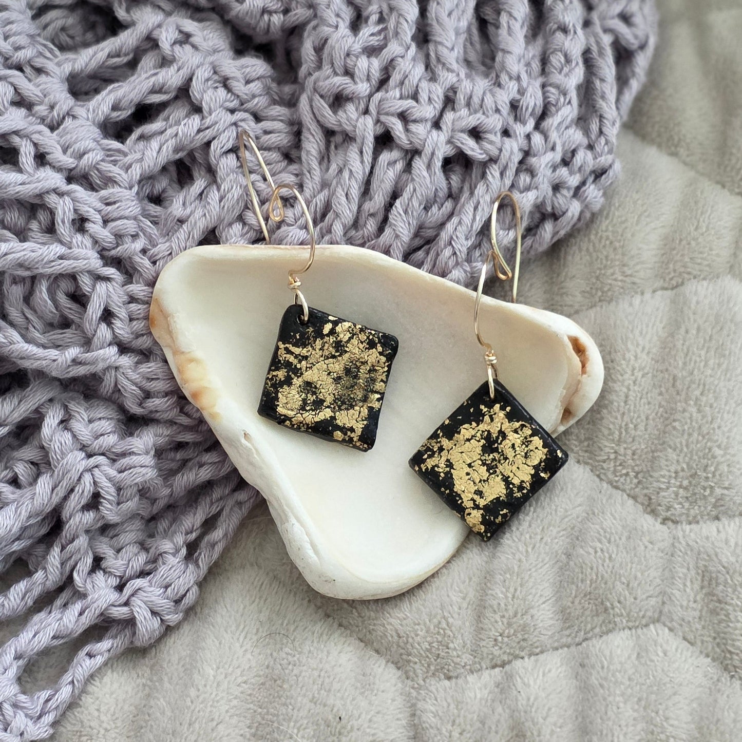 polymer clay earrings, black earrings, gold earrings, geometric earrings, handmade earrings, artisan jewelry, statement earrings, modern earrings, minimalist jewelry, dangle earrings, elegant earrings, unique earrings