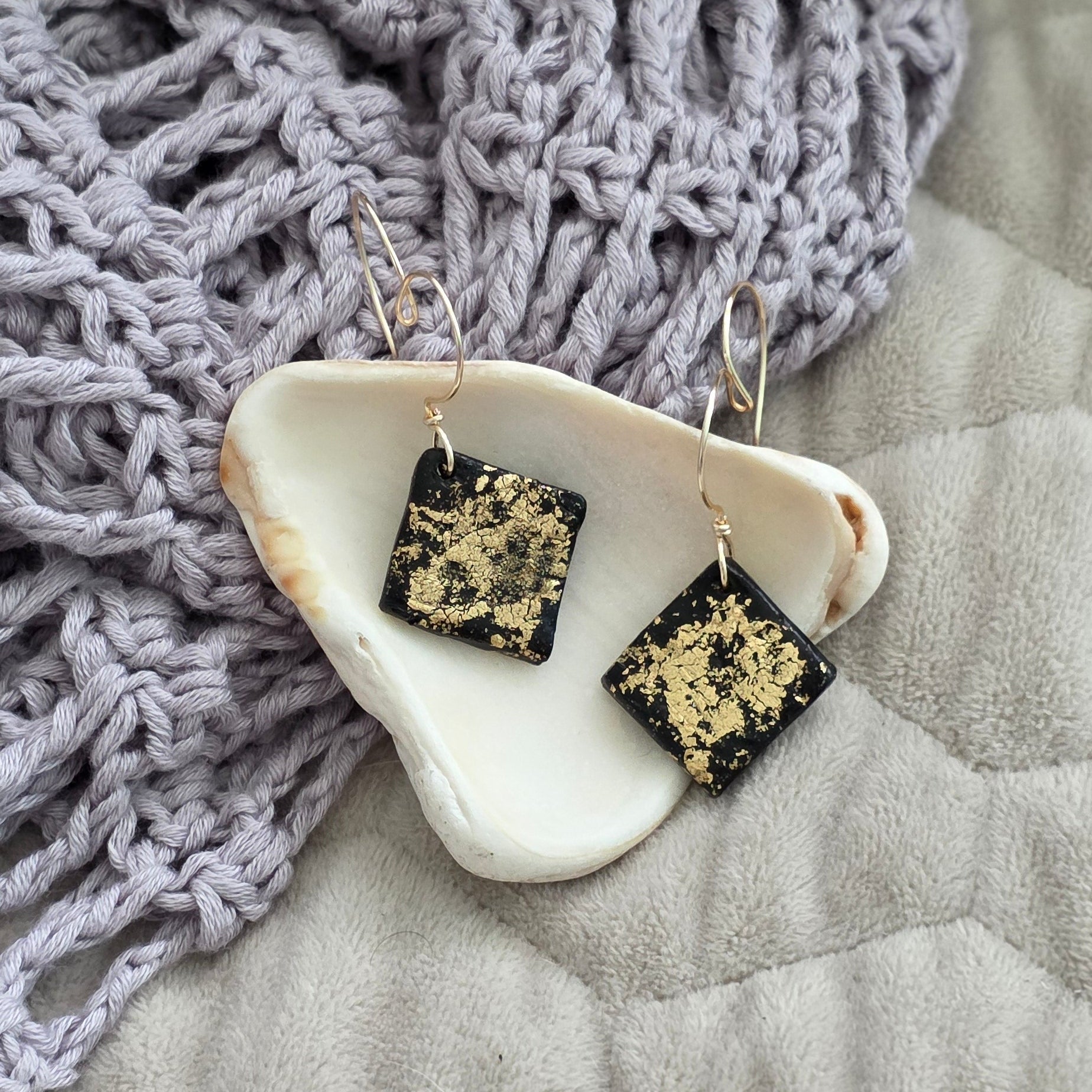 polymer clay earrings, black earrings, gold earrings, geometric earrings, handmade earrings, artisan jewelry, statement earrings, modern earrings, minimalist jewelry, dangle earrings, elegant earrings, unique earrings