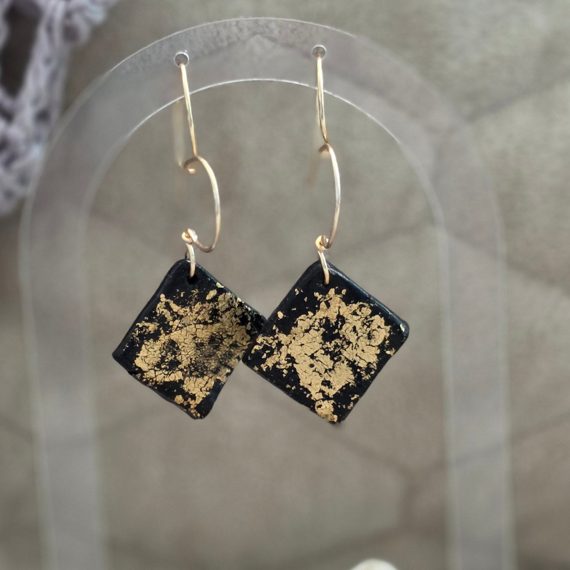 polymer clay earrings, black earrings, gold earrings, geometric earrings, handmade earrings, artisan jewelry, statement earrings, modern earrings, minimalist jewelry, dangle earrings, elegant earrings, unique earrings