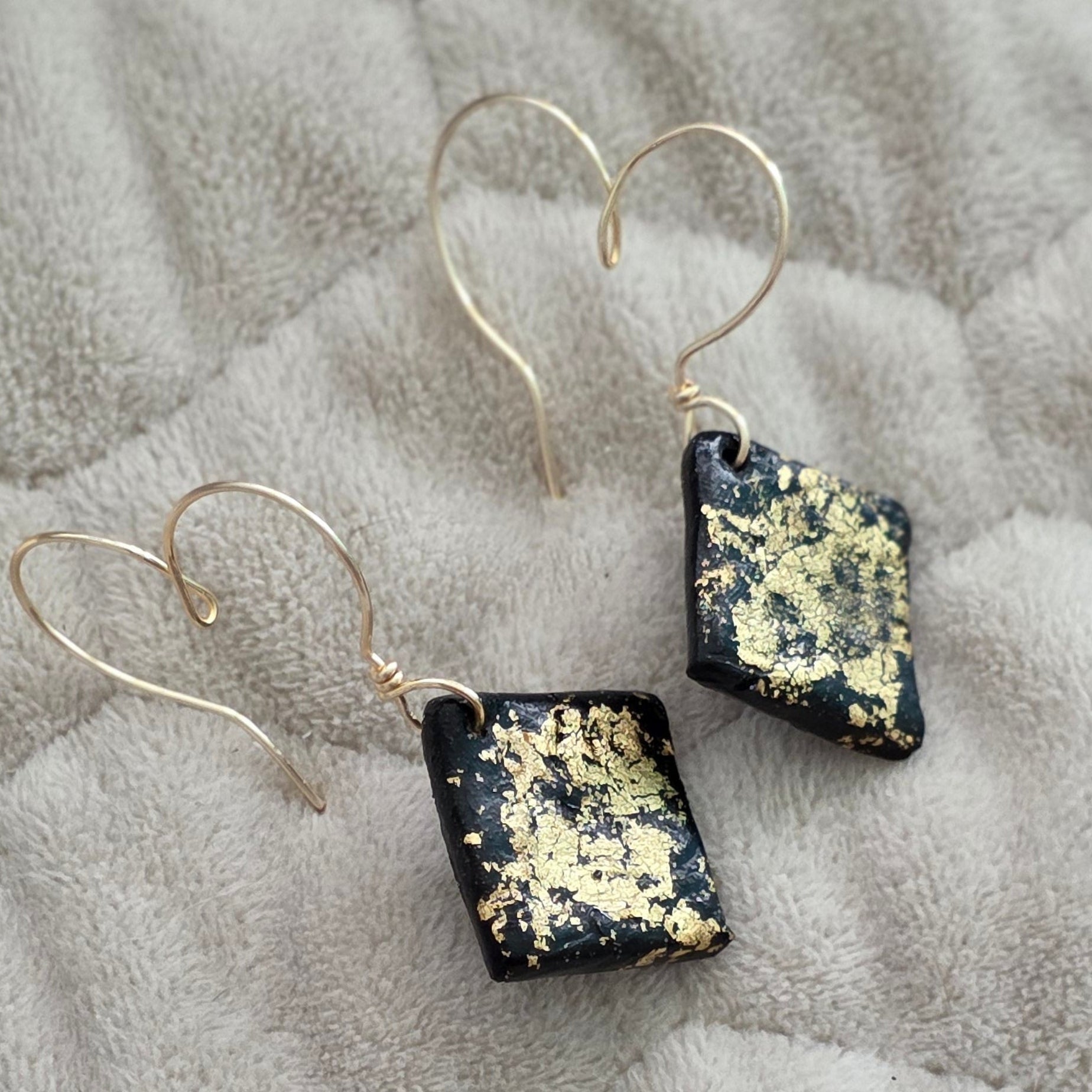 polymer clay earrings, black earrings, gold earrings, geometric earrings, handmade earrings, artisan jewelry, statement earrings, modern earrings, minimalist jewelry, dangle earrings, elegant earrings, unique earrings